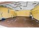 Spacious garage with storage shelves, a workbench, and ample room for vehicles at 61 Bryan Cave Rd, South Daytona, FL 32119