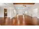 Open-concept layout showcases spacious living room, kitchen, and front door for a seamless flow at 61 Bryan Cave Rd, South Daytona, FL 32119