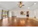 Bright living room boasts hardwood floors, open access to the kitchen, and sliding doors to the backyard at 61 Bryan Cave Rd, South Daytona, FL 32119