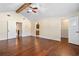 Spacious main bedroom features vaulted ceiling, hardwood floors, and ensuite bathroom and walk-in closet at 61 Bryan Cave Rd, South Daytona, FL 32119