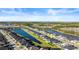 A high aerial view showcasing the community's serene pond and wooded areas at 617 Mosaic Blvd, Daytona Beach, FL 32124