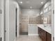 Modern bathroom featuring a glass enclosed shower, dual vanity sinks, and stylish fixtures at 617 Mosaic Blvd, Daytona Beach, FL 32124