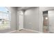 Bright and airy bedroom with neutral walls, tile floor and an ensuite bathroom at 617 Mosaic Blvd, Daytona Beach, FL 32124