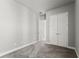 Bedroom with gray walls, gray carpet, with double doors and ceiling fan at 617 Mosaic Blvd, Daytona Beach, FL 32124