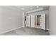 Bright and neutral empty room with plush carpeting, an open layout, and access to ensuite bathroom at 617 Mosaic Blvd, Daytona Beach, FL 32124