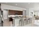 Modern kitchen with dark wood cabinets, granite countertops, and stainless steel appliances at 617 Mosaic Blvd, Daytona Beach, FL 32124