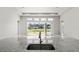 Open concept kitchen with granite countertops and stainless steel sink, connected to a bright living area at 617 Mosaic Blvd, Daytona Beach, FL 32124