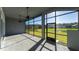 Enjoy this screened patio with fan overlooking expansive backyard at 617 Mosaic Blvd, Daytona Beach, FL 32124