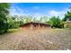 A brick house is shown with a large backyard at 6185 Shoreline Dr, Port Orange, FL 32127