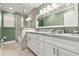 Bathroom featuring double vanity, granite countertops, and tiled shower at 6185 Shoreline Dr, Port Orange, FL 32127