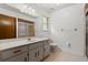 Clean bathroom with single sink vanity, matching cabinets, and enclosed shower at 6185 Shoreline Dr, Port Orange, FL 32127