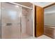 Bathroom featuring a shower with glass doors and tile flooring at 6185 Shoreline Dr, Port Orange, FL 32127