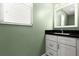 Bathroom featuring a white vanity with dark countertop and mirror at 6185 Shoreline Dr, Port Orange, FL 32127