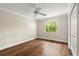 Bedroom with hardwood floors, neutral walls, and natural light at 6185 Shoreline Dr, Port Orange, FL 32127