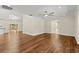 Inviting living room featuring gleaming hardwood floors, recessed lighting and a neutral color palette at 6185 Shoreline Dr, Port Orange, FL 32127