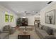 Comfortable living room showcasing hardwood floors, neutral tones, and an abundance of natural light at 6185 Shoreline Dr, Port Orange, FL 32127