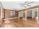 Spacious living room featuring hardwood floors and brick accents at 6185 Shoreline Dr, Port Orange, FL 32127