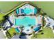 Aerial view of community pool showcasing its unique geometric design, lounge chairs, and beautiful landscaping at 633 Mosaic Blvd, Daytona Beach, FL 32124