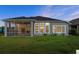 Well-maintained backyard featuring a screened-in porch and bright, natural light, ideal for outdoor enjoyment at 633 Mosaic Blvd, Daytona Beach, FL 32124