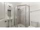 Bathroom featuring glass enclosed shower, toilet and pedestal sink at 633 Mosaic Blvd, Daytona Beach, FL 32124