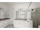 Spacious bathroom with double sinks, a tiled shower with glass doors, and ample storage at 633 Mosaic Blvd, Daytona Beach, FL 32124