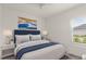 Comfortable bedroom featuring a queen bed and large sunny window at 633 Mosaic Blvd, Daytona Beach, FL 32124