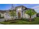 Attractive single-story home with manicured lawn and lush landscaping at 633 Mosaic Blvd, Daytona Beach, FL 32124
