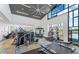 Bright gym featuring modern equipment, high ceilings with a ceiling fan, and large windows offering plenty of natural light at 633 Mosaic Blvd, Daytona Beach, FL 32124
