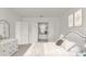 Serene bedroom with neutral decor, a view into the main bathroom, and ample natural light at 633 Mosaic Blvd, Daytona Beach, FL 32124