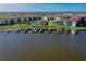 Waterfront condo complex featuring boat docks, lush landscaping, and a community pool with views of the Halifax River at 719 S Beach St # 302B, Daytona Beach, FL 32114
