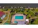 Community pool with lounge chairs surrounded by landscaping, palm trees, and water views at 719 S Beach St # 302B, Daytona Beach, FL 32114
