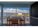 Relaxing screened-in balcony with a table and chairs, offering parking lot views at 719 S Beach St # 302B, Daytona Beach, FL 32114