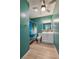 Bathroom featuring a shower/tub combination, a vanity, and a ceiling fan at 719 S Beach St # 302B, Daytona Beach, FL 32114