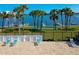 Community area with lounge chairs, grassy area, and water views at 719 S Beach St # 302B, Daytona Beach, FL 32114