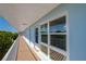 Exterior view of the condo building with a walkway, balcony, and water views at 719 S Beach St # 302B, Daytona Beach, FL 32114