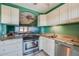 Kitchen with stainless steel appliances and a pass-through window to the living room at 719 S Beach St # 302B, Daytona Beach, FL 32114