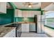 Kitchen with stainless steel appliances, granite countertops, and white cabinets at 719 S Beach St # 302B, Daytona Beach, FL 32114