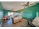 Living room with hardwood floors, comfortable seating, and a ceiling fan at 719 S Beach St # 302B, Daytona Beach, FL 32114