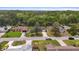 Beautiful aerial view of a quiet neighborhood with mature trees, well-manicured lawns, and houses at 736 Lindenwood W Cir, Ormond Beach, FL 32174