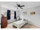 Bright bedroom with a ceiling fan, nice decorations, and a window with natural light at 736 Lindenwood W Cir, Ormond Beach, FL 32174