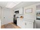 Bright kitchen features stainless steel appliances, white cabinetry, and a modern subway tile backsplash at 736 Lindenwood W Cir, Ormond Beach, FL 32174