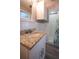 Updated bathroom featuring granite countertop vanity and enclosed shower at 925 Halstead St, Deltona, FL 32725