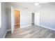 Bright bedroom features modern gray walls, ceiling fan, and wood-look floors at 925 Halstead St, Deltona, FL 32725
