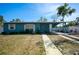 Charming single-story home with blue exterior, covered entry and walkway, and drought resistant landscaping at 925 Halstead St, Deltona, FL 32725