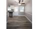 Bright eat-in kitchen with stainless appliances, granite countertops, and gray and white color scheme at 925 Halstead St, Deltona, FL 32725