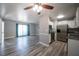 Bright living room flows into an eat-in kitchen with granite countertops and stainless appliances at 925 Halstead St, Deltona, FL 32725