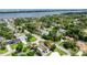 Wide aerial shot showcasing the property's neighborhood, lush landscaping, and proximity to the bay at 952 Northbrook Dr, Ormond Beach, FL 32174