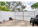 Fenced in backyard features a metal privacy gate and outdoor seating at 952 Northbrook Dr, Ormond Beach, FL 32174