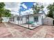 Spacious backyard patio with a pergola and shed, perfect for outdoor entertaining and storage at 952 Northbrook Dr, Ormond Beach, FL 32174