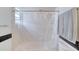 Well-lit bathroom with a shower-tub combo with tile surround and a shower curtain at 952 Northbrook Dr, Ormond Beach, FL 32174